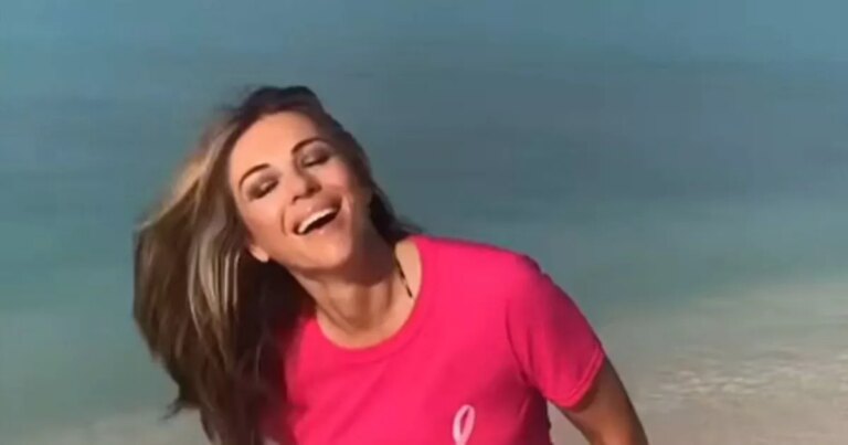 Ageless-Liz-Hurley-channels-Barbie-in-pink-t-shirt-and-thong-on-the-beach.jpg