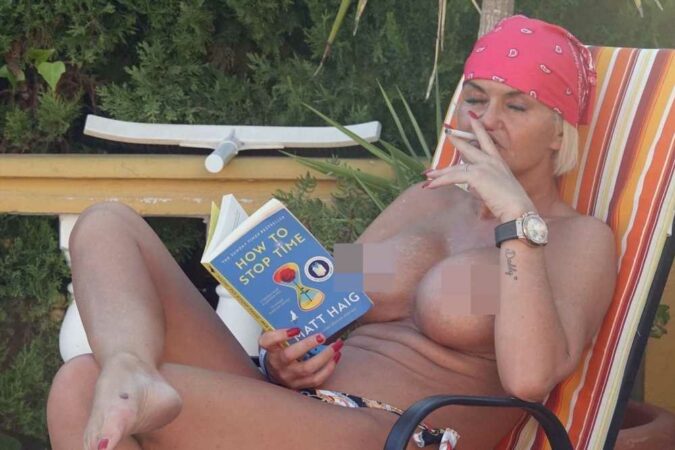 Danniella-Westbrook-strips-off-as-she-sunbathes-topless-and-smokes-by-the-pool-in-Spain-The-Sun.jpg