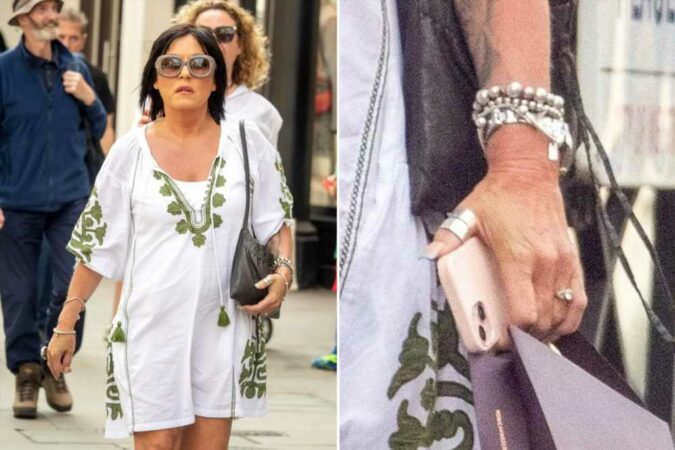 EastEndersx27-Jessie-Wallace-shows-off-her-sparkling-engagement-ring-as-she-steps-out-in-white-summer-dress-The-Sun.jpg