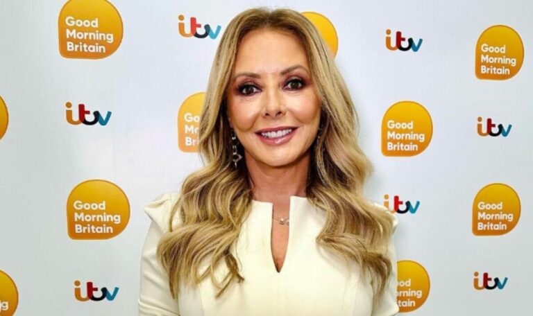 Carol-Vorderman-wows-fans-as-she-squeezes-hourglass-curves-into-tight-dress.jpg