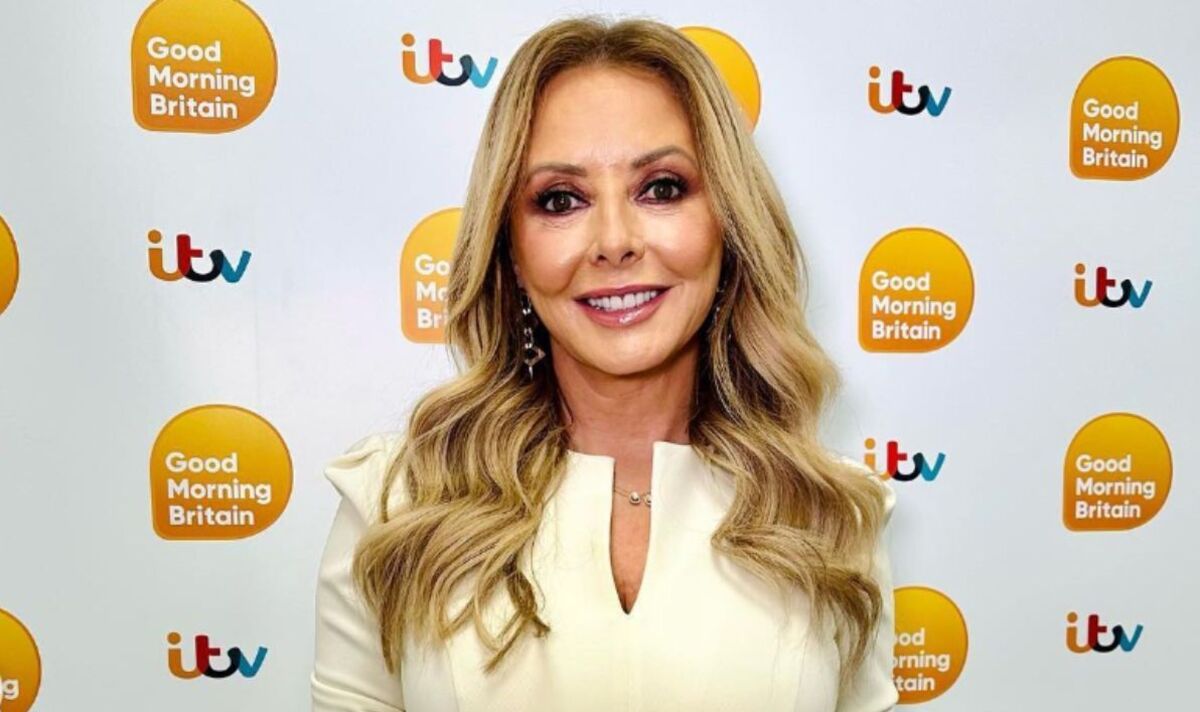 Carol-Vorderman-wows-fans-as-she-squeezes-hourglass-curves-into-tight-dress.jpg