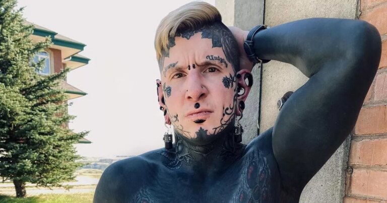 Dad-with-96-of-body-inked-shows-entire-back-tattooed-in-gruesome-clip.jpg